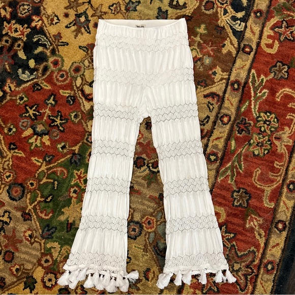 Show me your MuMu white bell bottom pants. - Picture 2 of 5